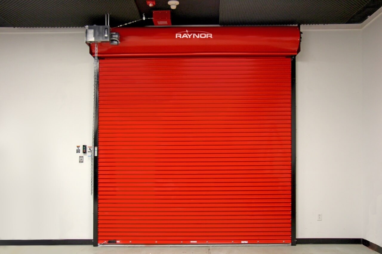 Red Raynor fire-rated commercial rolling door