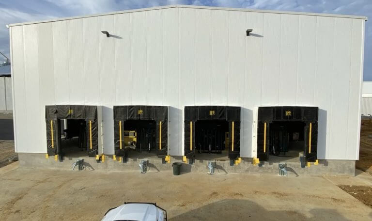 Commercial warehouse with multiple loading dock bays and equipment