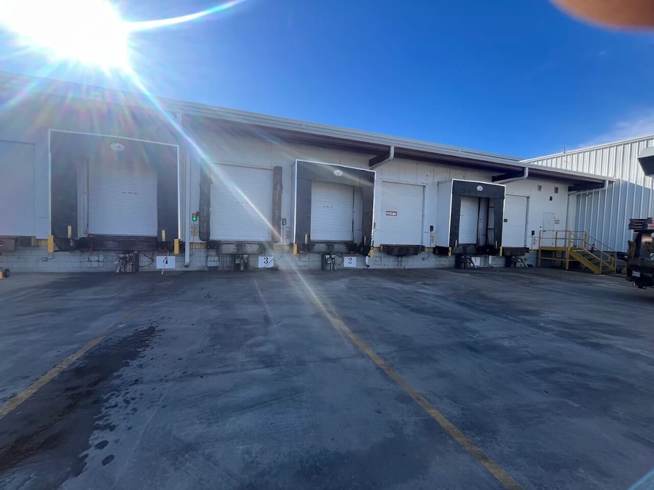 Commercial warehouse with multiple loading dock bays and equipment